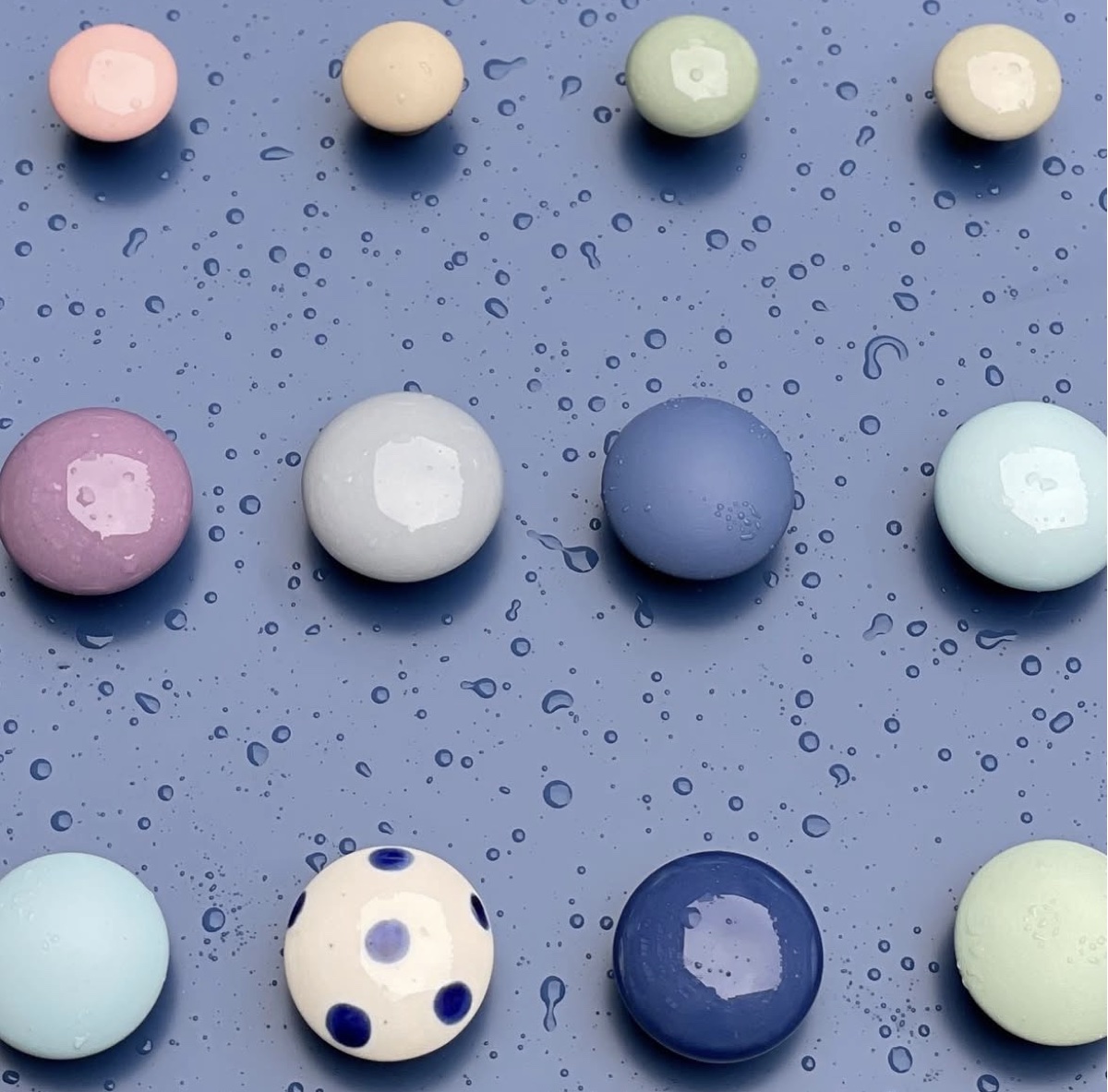 porcelain hooks on the painted display board
